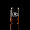 Wholesale engraved 5 oz. Short Can Taster Glass customized with Devils Due Distilling logo on a black background