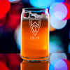 Wholesale engraved 16 oz. Beer Can Glass customized with Wilshire Country Club logo on a bokeh background