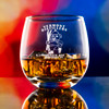 Wholesale engraved 15 oz. Hogs Head Rocks Glass customized with Vermont Distillers logo on a bokeh background