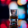 Wholesale engraved 2 oz. Small Batch Shot Glass customized Tarnished Truth Distillers logo on a bokeh background