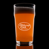 Wholesale engraved 20 oz. English Nonic Pub Glass customized with Cabbage Shed logo on a black background