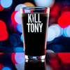 Wholesale engraved 16 oz. Classic Pint Glass customized with Kill Tony logo on a bokeh background