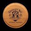 Wholesale engraved Golden Wheat Round Coaster customized with Chuckanut Bay Distillery logo on a black background