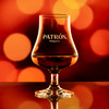 Wholesale engraved 6.5 oz. Stolzle Nosing Glass customized with Patron Tequila logo on a bokeh background