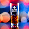 Wholesale engraved 11 oz. Luna HighBall Glass customized with Big Cypress Distillery logo on a bokeh background