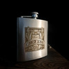 Wholesale engraved 6 oz. Premium Stainless Steel Flask customized with McMenamin's logo on a black background