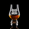 Wholesale engraved Glencairn Whisky Glass customized with McMenamins Kennedy School logo on a black background
