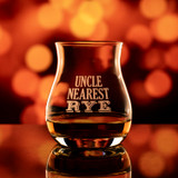 Wholesale engraved Glencairn Mixer Glass customized with Uncle Nearest Rye logo on a bokeh background