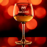 Wholesale engraved 13 oz. Select Wine Glass customized with Bacardi logo on a bokeh background