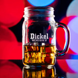 Wholesale engraved 16 oz. Glass Mason Mug customized with Dickel Whisky logo on a bokeh background