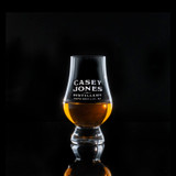 Wholesale engraved Wee Glencairn Glass customized with Casey Jones Distillers logo on a black background