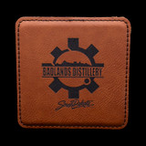 Wholesale engraved Cognac Brown Square Coaster customized with Badlands Distillery logo on a black background