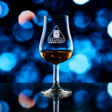 Wholesale engraved 4.75 oz. Urban Bar Spey Taster Glass customized with Triangle Bourbon Society logo on a bokeh background
