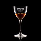 Wholesale engraved 5.25 oz. Nick & Nora Glass customized with Hanson Distillers logo on a black background