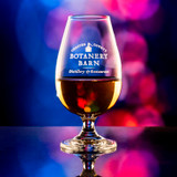 Wholesale engraved 6 oz. Urban Bar Malt Whiskey Taster customized with Botanery Barn logo on a bokeh background