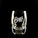 Wholesale engraved 2.5 oz. Urban Bar Barrel Dram Glass customized with Bayou Rum logo on a black background