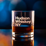 Wholesale engraved 8.25 oz. BootLegger Bourbon Glass customized with Hudson Whiskey logo on bokeh background