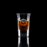 Wholesale engraved 1 oz. Bourbon Sip Shot Glass customized with Hemingway Rum logo on a black background