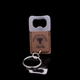 Wholesale engraved Square Rum Keychain Bottle Opener customized with Seven Three Distillery logo on a black background