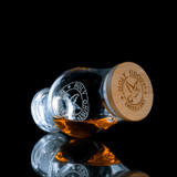 Wholesale engraved Glencairn Barrel Cap customized with Holy Ghost Distillery logo on a black background