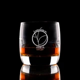 Wholesale engraved 7 oz. Pico Nordic Rocks glass customized with Odelo Distillers logo on a black background
