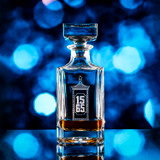 Wholesale engraved 16 oz. Pint-Sized Whiskey Decanter customized with City Gate logo on bokeh background