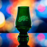 Wholesale engraved Green Glencairn blind tasting glass customized with Eagle Rare Whiskey logo on a Bokeh background