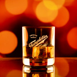 Wholesale engraved 6.5 oz. Stolzle New York Bar Rocks customized with Templeton Distillers logo on a bokeh background
