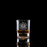 Wholesale engraved 1.5 oz. Venus Shot Glass customized with EOD Distillers logo on a black background
