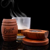 Wholesale engraved Barrel Cocktail Smoker customized with Bayou Rum logo on a black background