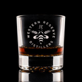 Wholesale engraved 10.5 oz. Nob Hill Rocks Glass customized with Western Reserve Distillers logo on a black background