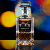 Wholesale engraved Carats Whiskey Decanter customized with Hard Truth logo on a bokeh background
