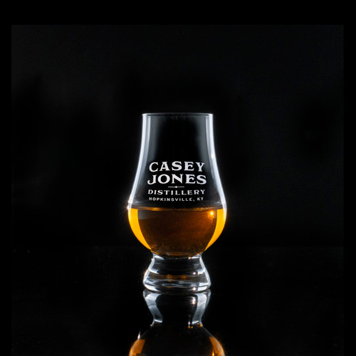 Wholesale engraved Wee Glencairn Glass customized with Casey Jones Distillers logo on a black background