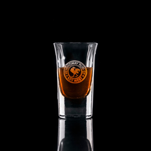 Wholesale engraved 1 oz. Bourbon Sip Shot Glass customized with Hemingway Rum logo on a black background