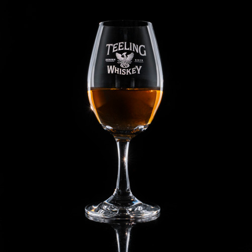 Wholesale engraved Glencairn Copita Nosing Glass customized with Teeling Whiskey logo on a black background