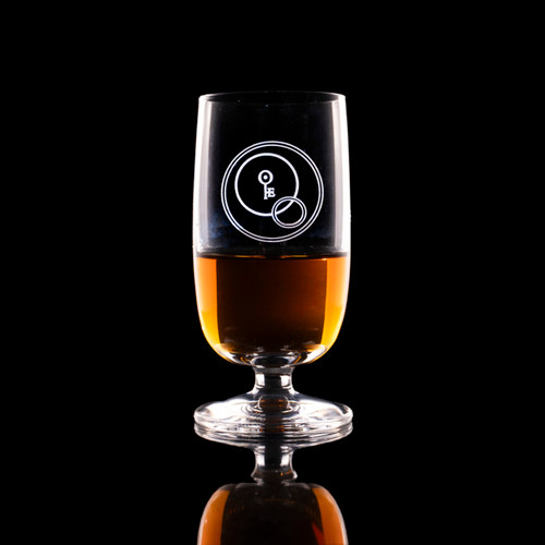 Wholesale engraved Stolzle Tasting Glass #4 customized with Obscure Distillers logo on a black background