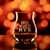 Wholesale engraved Glencairn Mixer Glass customized with Uncle Nearest Rye logo on a bokeh background