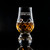 Wholesale engraved Crystal Cut Glencairn Whisky Glass customized with Smooth Ambler logo on a black background
