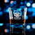 Wholesale engraved 10.5 oz Bardic Old Fashioned Rocks Glass customized with Boogie Barn Bourbon logo on a bokeh background