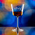 Wholesale engraved 5.5 oz. Romeo Nick & Nora Glass customized with Hard Truth Distillers logo on a bokeh background