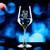 Wholesale engraved 12.75 oz. Revolution Wine Glass customized with PJ Flower logo on a bokeh background