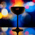 Wholesale engraved Stolzle Black & Copper Glisten Coupe Glass customized with Sazerac House logo on a bokeh background