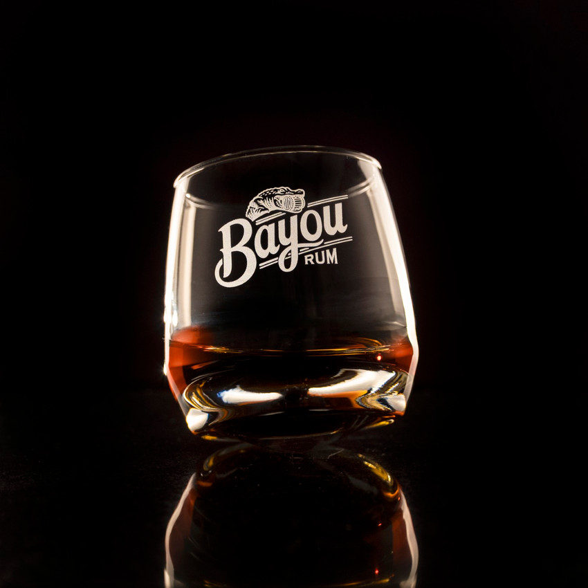 Wholesale engraved 7 oz. Wobble Whisky Glass customized with Bayou Rum logo black background