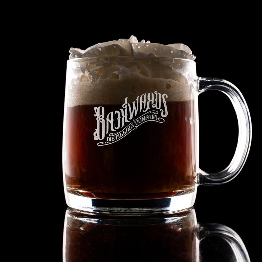 Wholesale engraved Nordic Whisky Glass Mug customized With Backwards Distillers logo on a black background