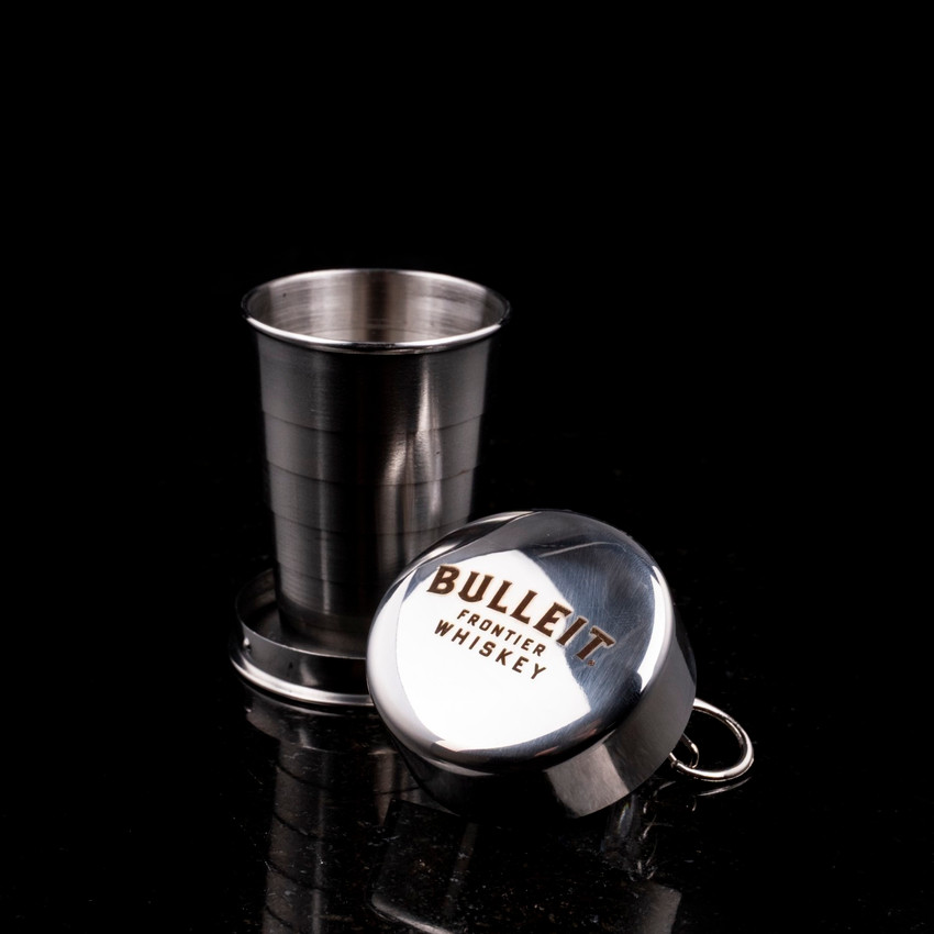 Wholesale engraved 2 oz. Collapsible Pocket Shot customized with Bulleit Bourbon logo on a black background