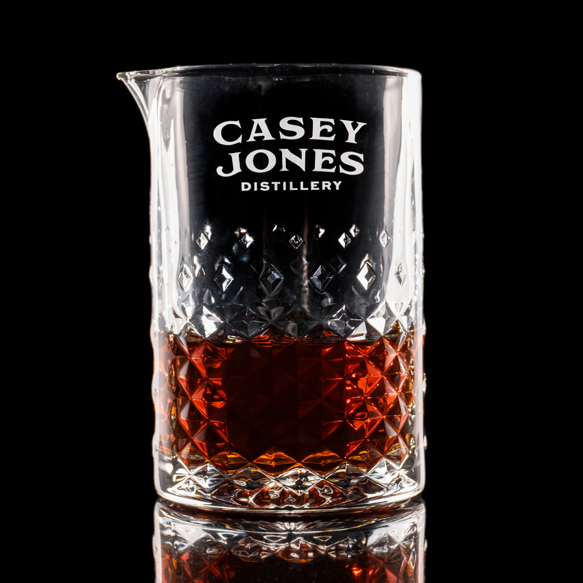 Wholesale engraved Carats Mixing Glass customized with Casey Jones Distillers logo on a black background