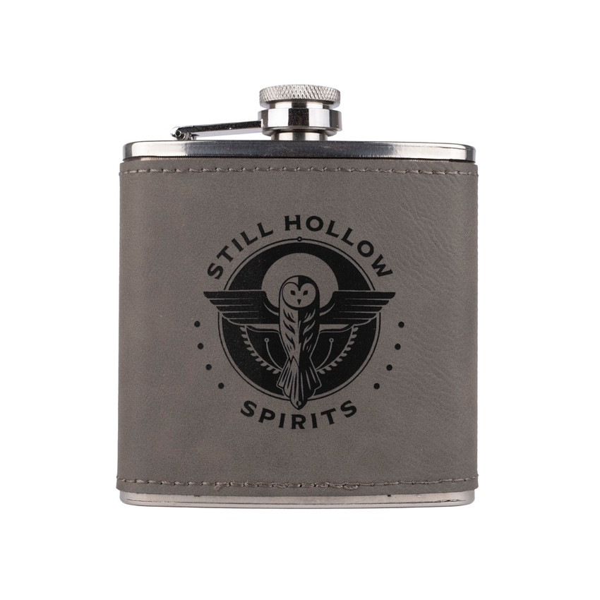 Wholesale engraved 6 oz. Gray Ultrahyde Flask customized with Still Hollow Spirits logo on a white background