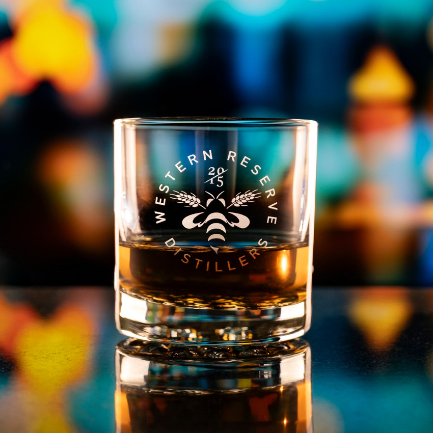 Wholesale engraved 10.25 oz. Nob Hill customized with Western Reserve Distillers logo on a bokeh background