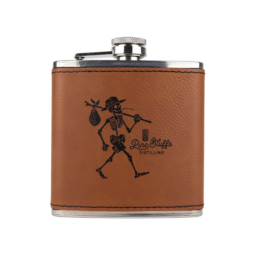Wholesale engraved 6 oz. Rawhide Brown Ultrahyde Flask customized with Pine Bluff Distilling logo on a white background