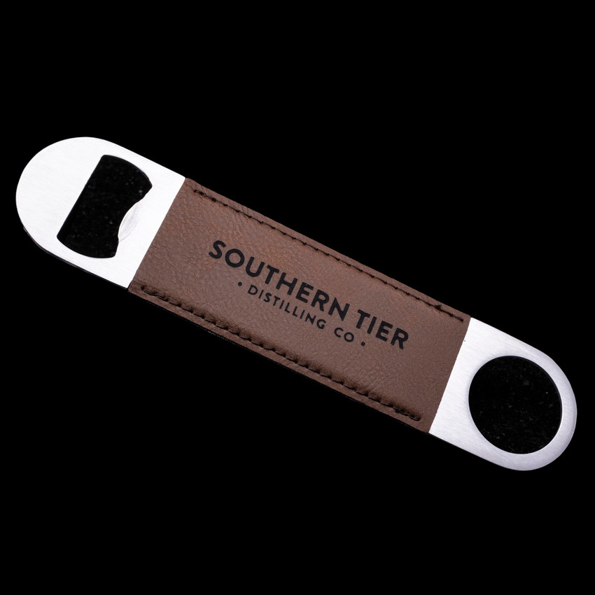 Wholesale engraved Rum Bottle Opener customized with Southern Tier Distilling logo on a black background